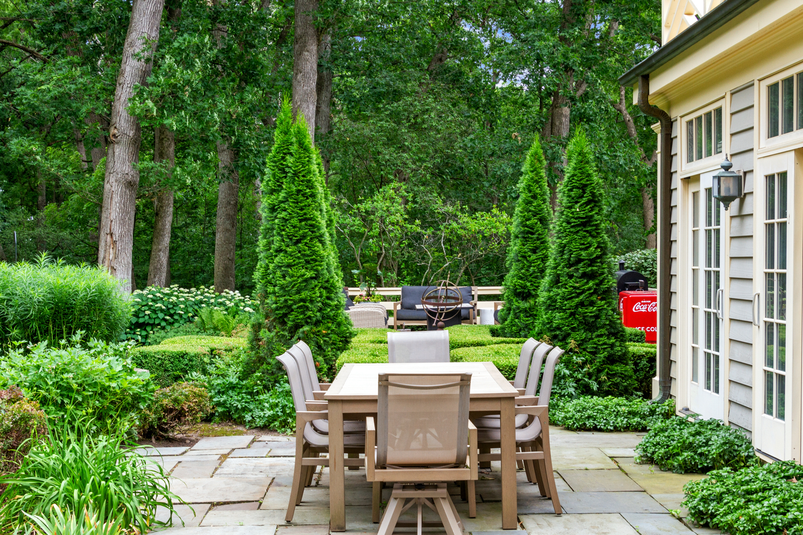 7208 White Oaks Road Harvard, IL 60033 - Photo 37 of 48 a view of a patio with table and chairs potted plants and large tree