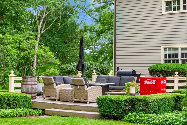 a view of a chairs and table in a yard