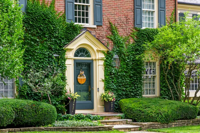 a front view of a house with garden