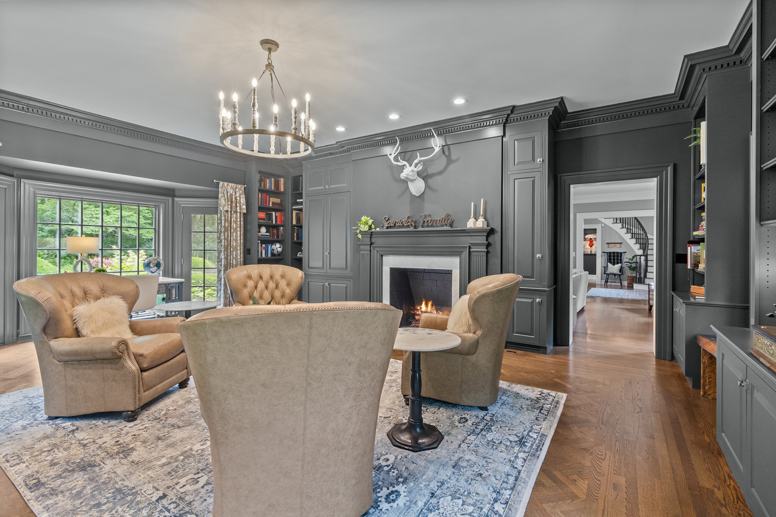 7208 White Oaks Road Harvard, IL 60033 - Photo 7 of 48 a living room with furniture and a chandelier