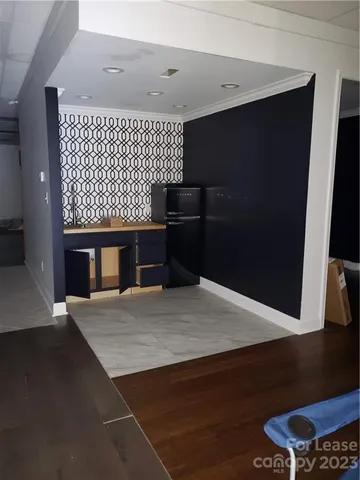 a kitchen with a sink and a refrigerator