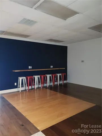 a view of a pool table and chairs