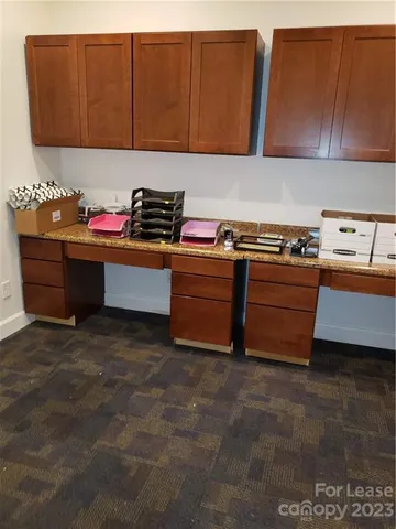 a room with furniture and cabinets