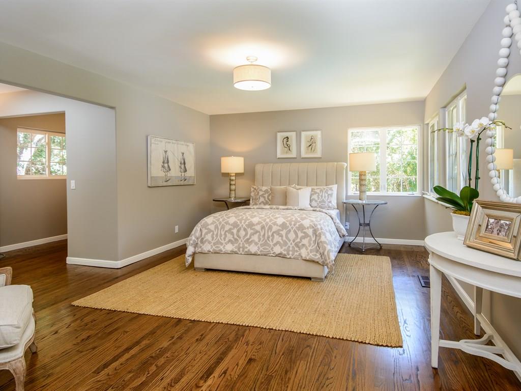 151 Eleanor Drive Woodside, CA 94062 - Photo 13 of 26 a bedroom with a bed a table and chair with wooden floor