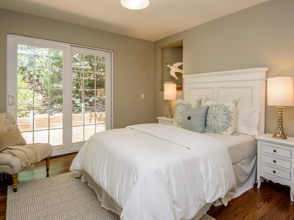 151 Eleanor Drive Woodside, CA 94062 - Photo 17 of 26 a bedroom with a bed and large windows