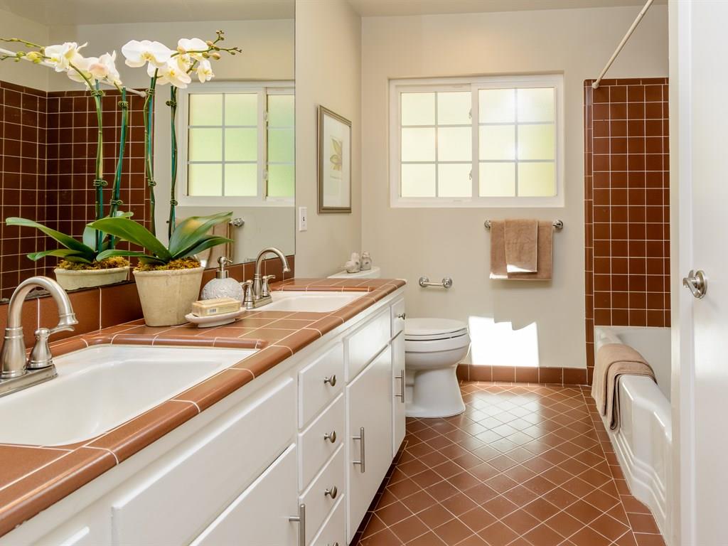 151 Eleanor Drive Woodside, CA 94062 - Photo 18 of 26 a bathroom with a double vanity sink toilet and shower