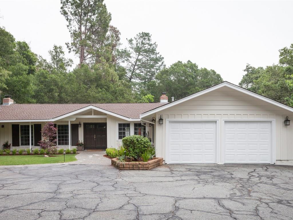 151 Eleanor Drive Woodside, CA 94062 - Photo 3 of 26 a view of a white house with a yard and large tree