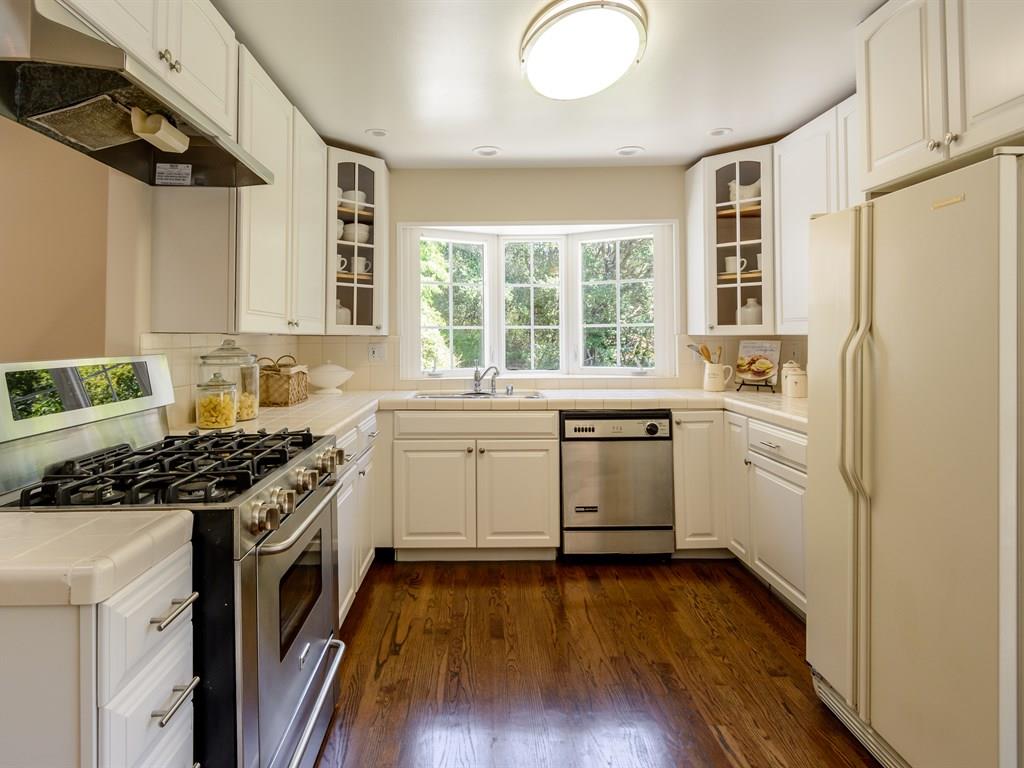 151 Eleanor Drive Woodside, CA 94062 - Photo 8 of 26 a kitchen with a stove a sink and a refrigerator