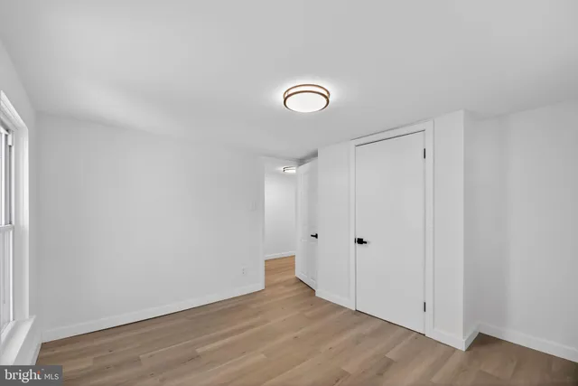 a view of room with wooden floor