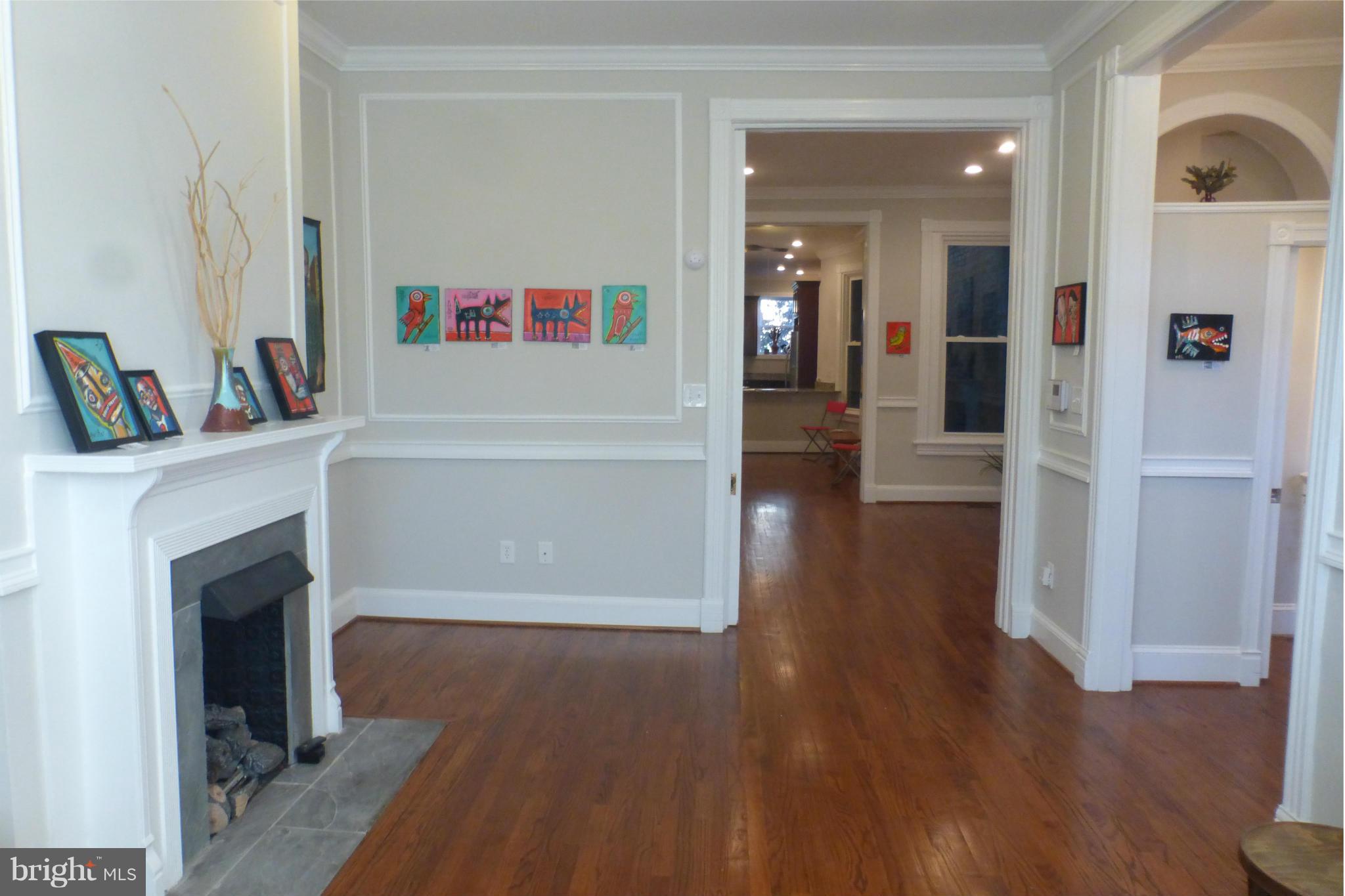 44 R Street Northeast Washington, DC 20002 - Photo 8 of 30 a view of a livingroom with wooden floor and a fireplace