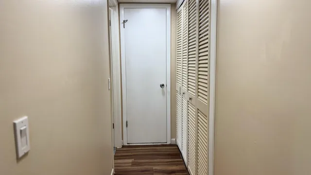 a view of a hallway with a white walls