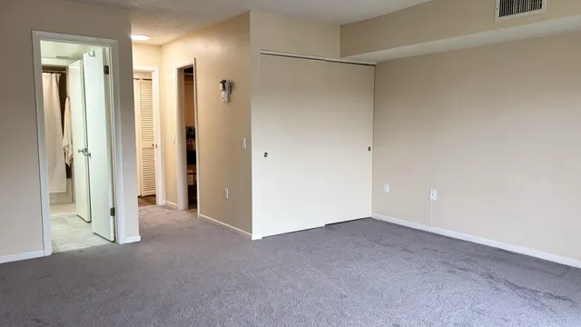 a view of an empty room with a window