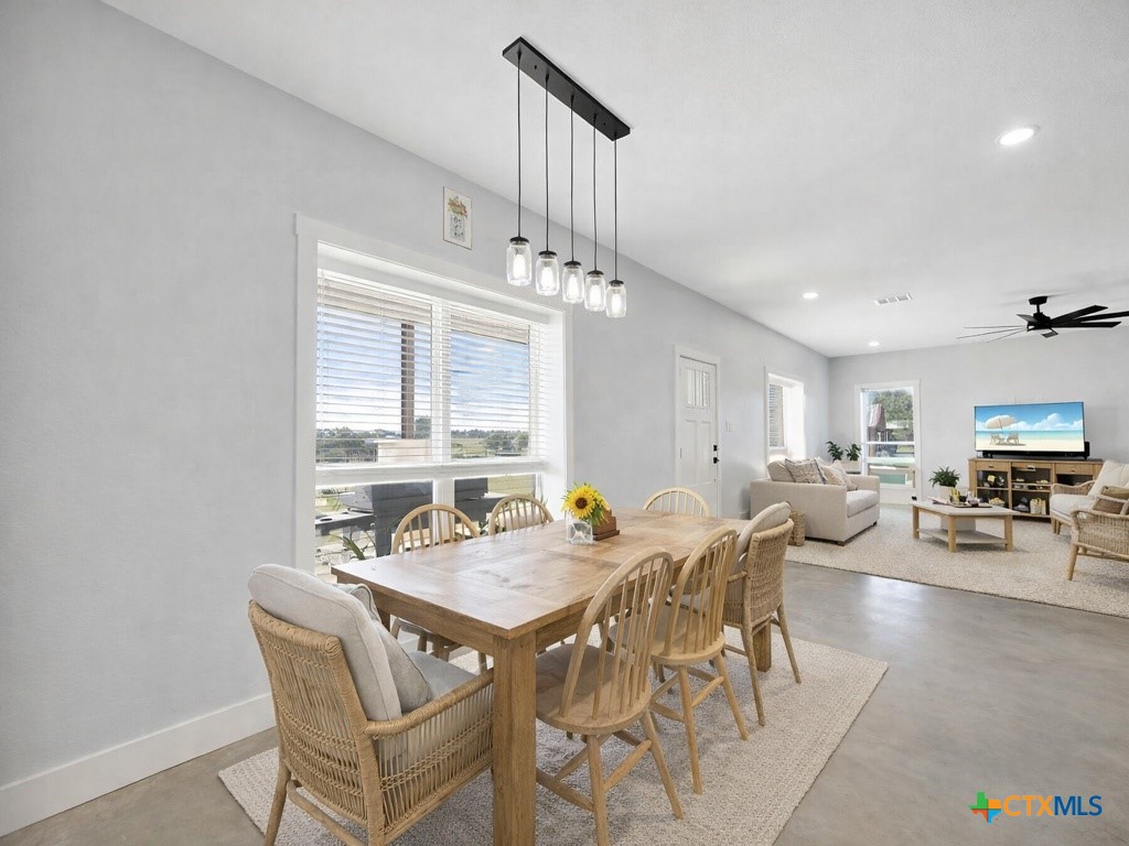 6887 Smith Dairy Road Belton, TX 76513 - Photo 14 of 48 a view of a dining room with furniture and a large window