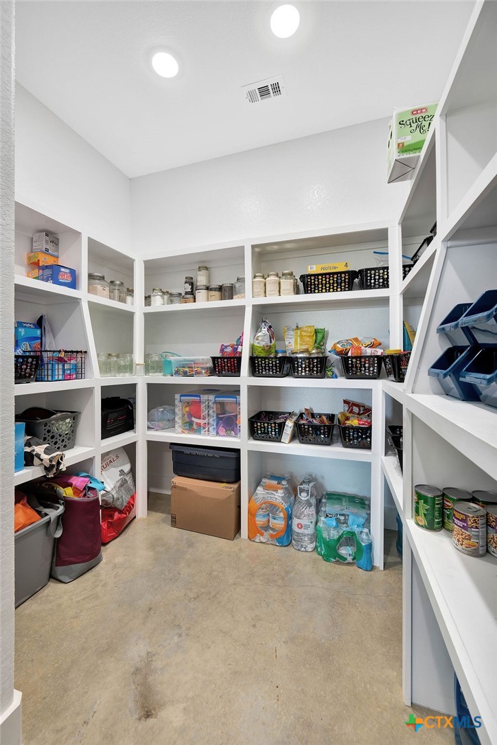 6887 Smith Dairy Road Belton, TX 76513 - Photo 20 of 48 a view of walk in closet with clothes and shoes