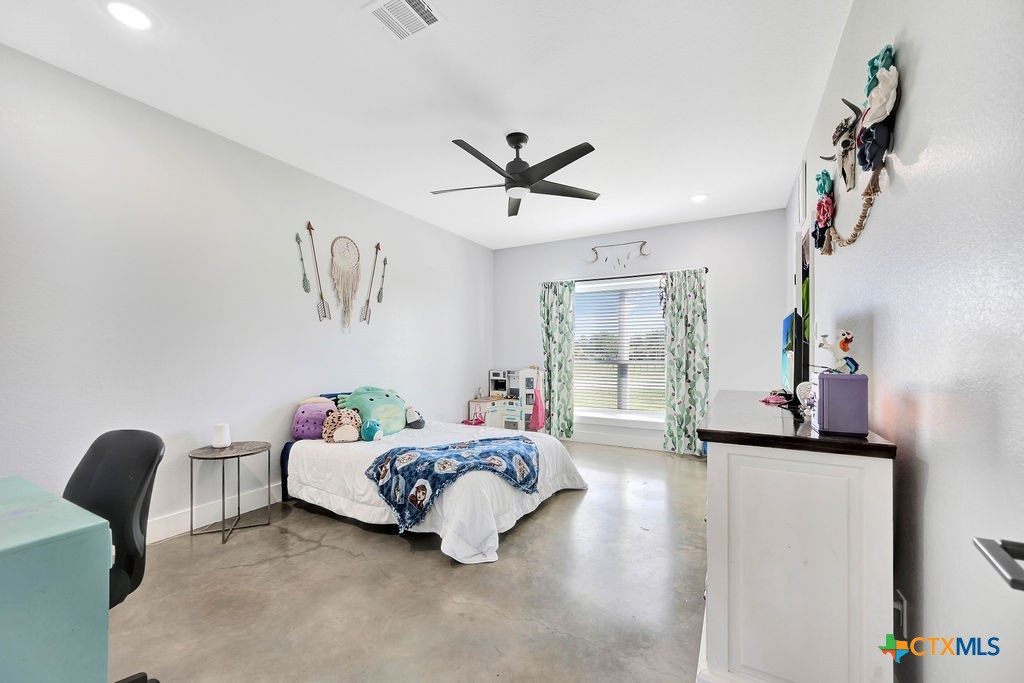 6887 Smith Dairy Road Belton, TX 76513 - Photo 27 of 48 a living room with furniture and a window