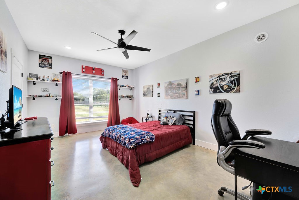 6887 Smith Dairy Road Belton, TX 76513 - Photo 28 of 48 a bedroom with a bed furniture and a window