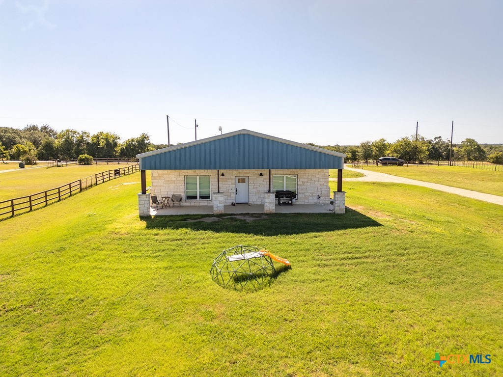 6887 Smith Dairy Road Belton, TX 76513 - Photo 37 of 48 a view of a swimming pool with an ocean view