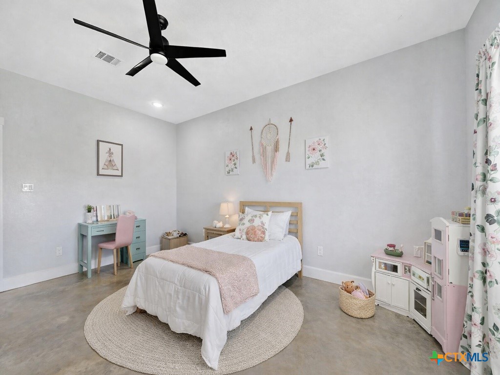 6887 Smith Dairy Road Belton, TX 76513 - Photo 7 of 48 a bedroom with a bed and furniture