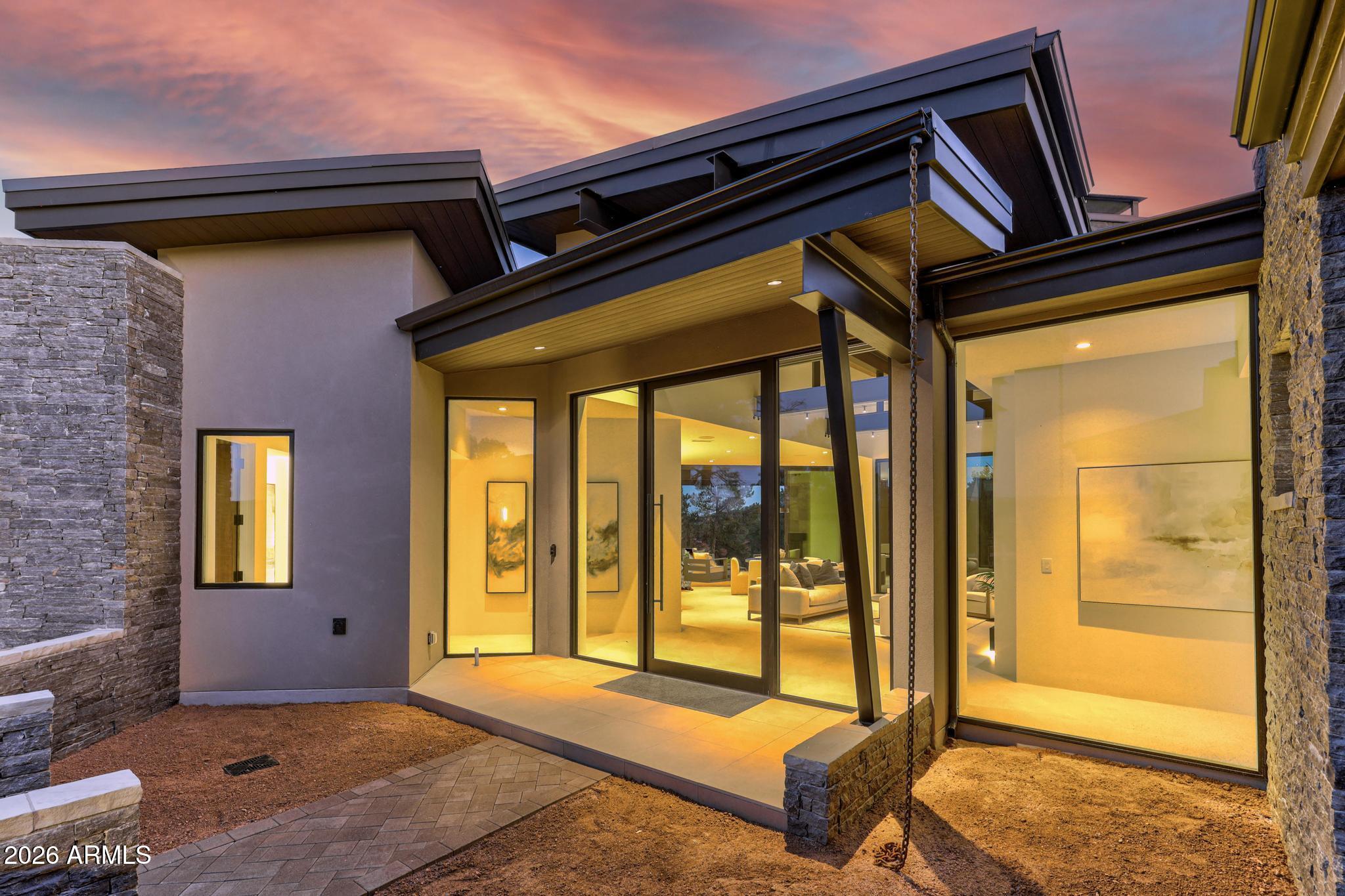 a front view of a house with a outdoor space