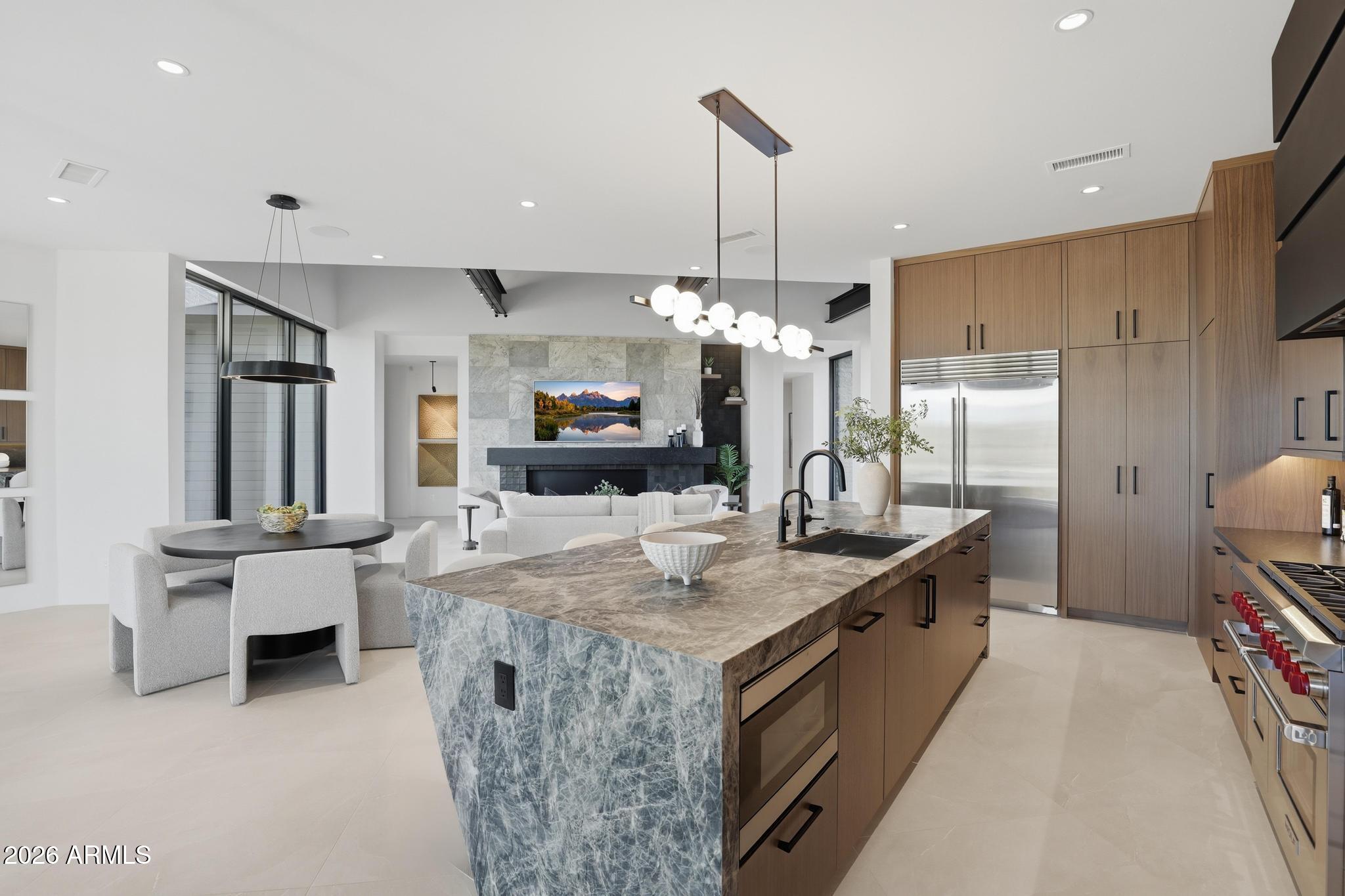 1002 South Dells Point Payson, AZ 85541 - Photo 3 of 5 a kitchen with kitchen island granite countertop a sink a counter top space appliances and cabinets