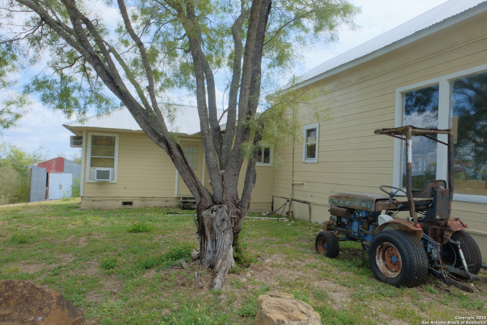 17585 Fargoer Way Marion, TX 78124 - Photo 25 of 34 a view of a yard with a car parked beside it