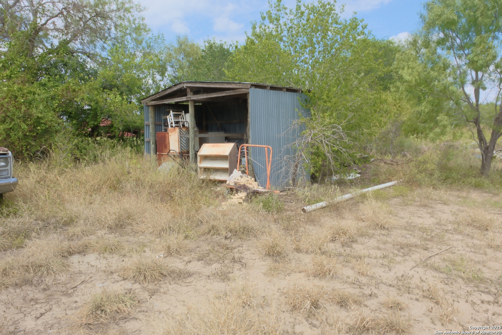 17585 Fargoer Way Marion, TX 78124 - Photo 29 of 34 a view of backyard with outdoor seating and covered with trees