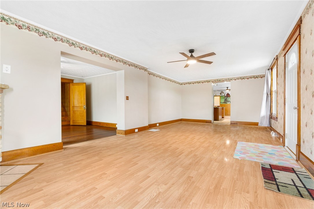 1640 Old Delaware Road Mount Vernon, OH 43050 - Photo 5 of 49 Unfurnished living room with light wood-style flooring and a ceiling fan