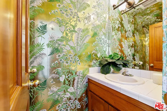 a bathroom with a sink and mirror