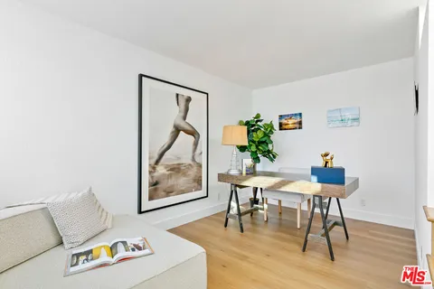 a workspace with furniture and wooden floor