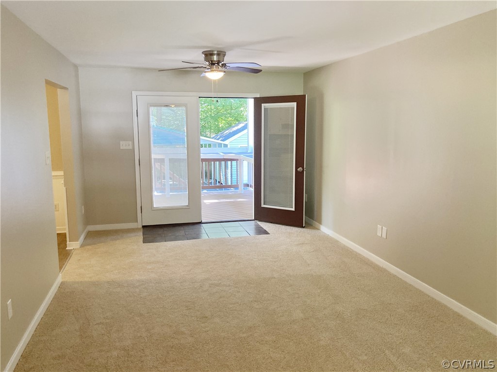 4730 Newbys Bridge Road Chesterfield, VA 23832 - Photo 12 of 24 an empty room with windows and chandelier fan