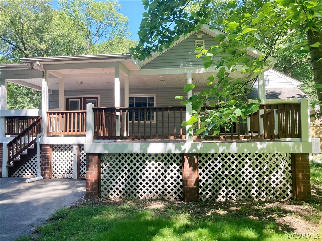 4730 Newbys Bridge Road Chesterfield, VA 23832 - Photo 23 of 24 a front view of a house with a garden