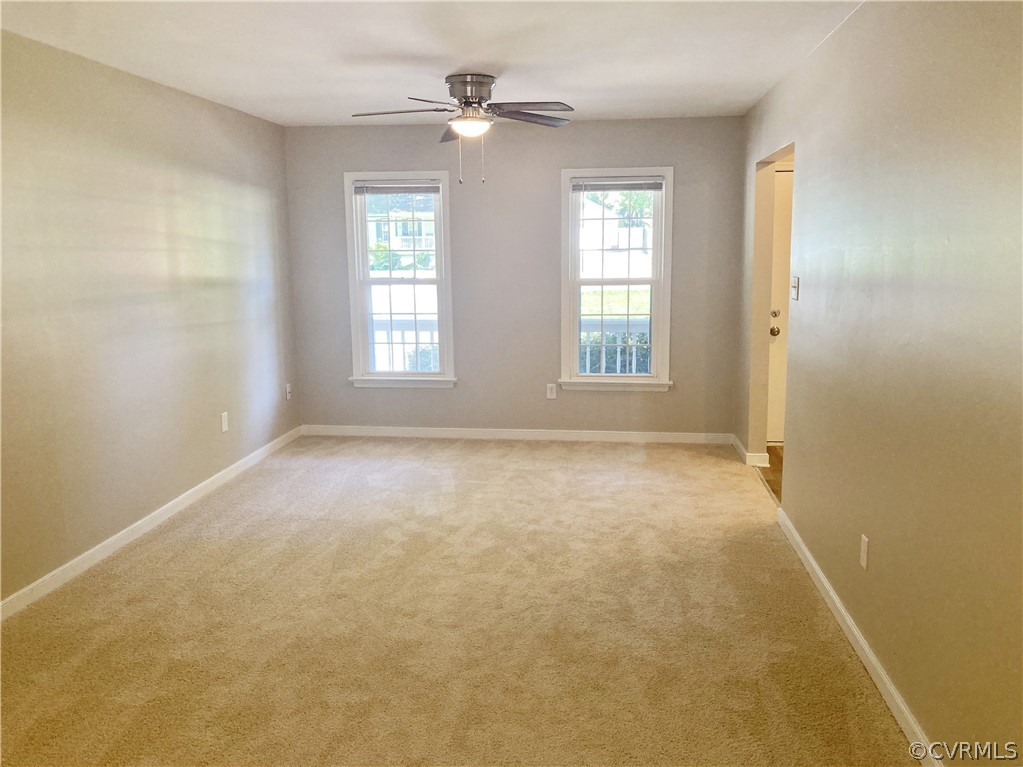 4730 Newbys Bridge Road Chesterfield, VA 23832 - Photo 10 of 24 an empty room with windows and chandelier fan