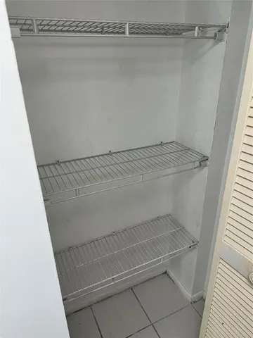 a view of a room with racks on the wall