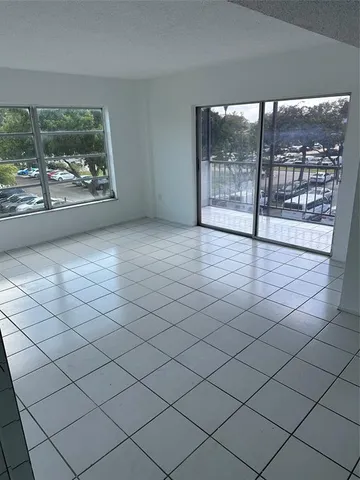 a view of an empty room with a large window