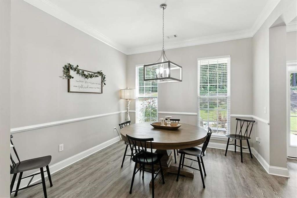 62 Joe Rowell Road Buchanan, GA 30113 - Photo 22 of 63 a view of a dining room with furniture window and wooden floor