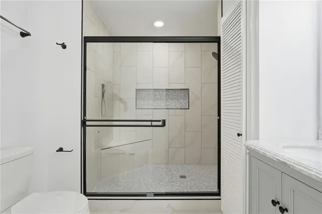 a bathroom with a bathtub and a shower