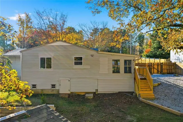 a view of a lake in between two of trees