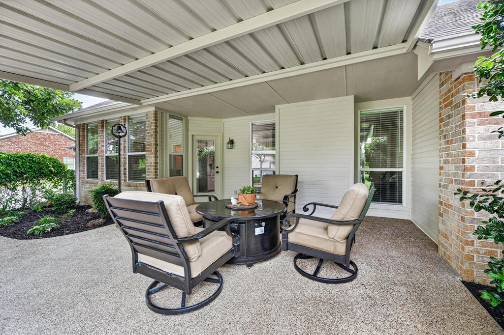 421 Ben Boyd Road Argyle, TX 76226 - Photo 18 of 25 Covered outdoor patio area featuring a textured concrete surface and a solid roof