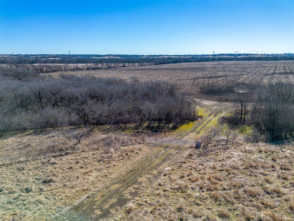 Tbd Ivy Lane Elm Mott, TX 76640 - Photo 13 of 18 a view of a dry yard with wooden fence