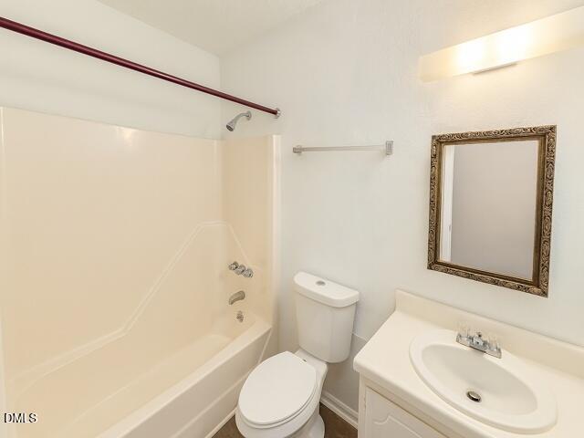 635 Pine Ridge Place Raleigh, NC 27609 - Photo 9 of 11 a bathroom with a sink toilet and shower