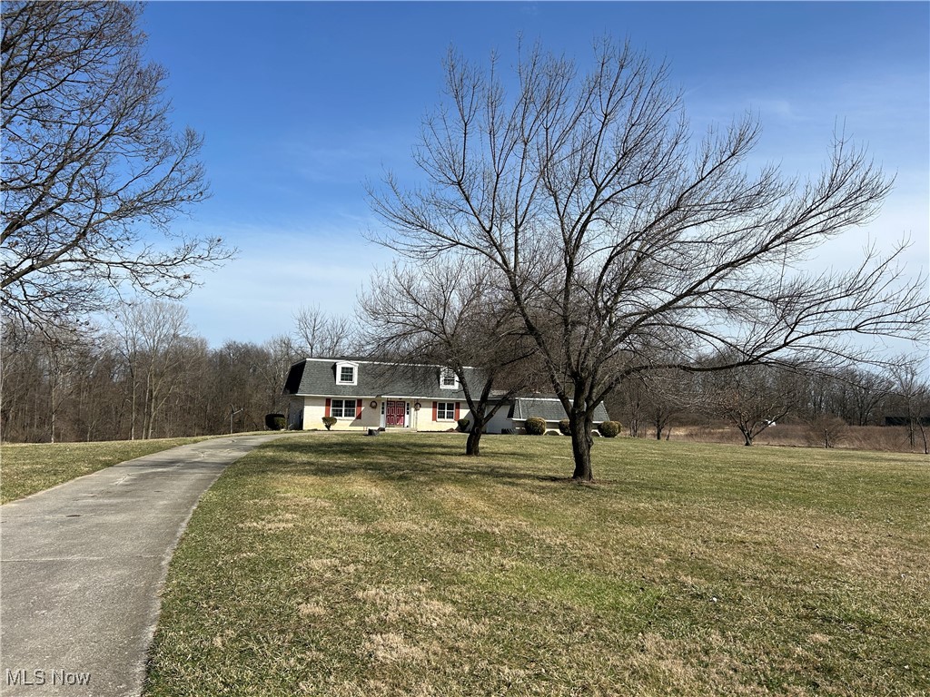 424 Ridge Road North North Fairfield, OH 44855 - Photo 5 of 48 Colonial inspired home with concrete driveway and a front yard