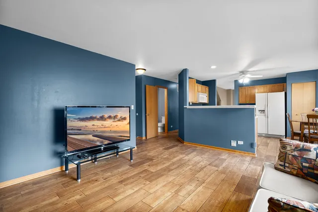 a view of room with workspace and windows