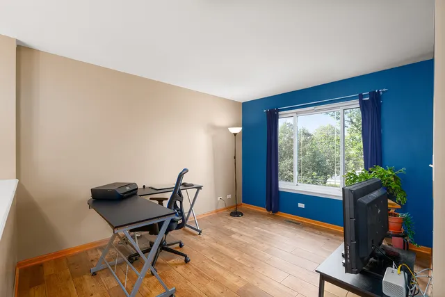 a workspace with furniture and a window