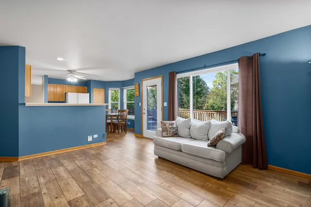 a living room with furniture and large window