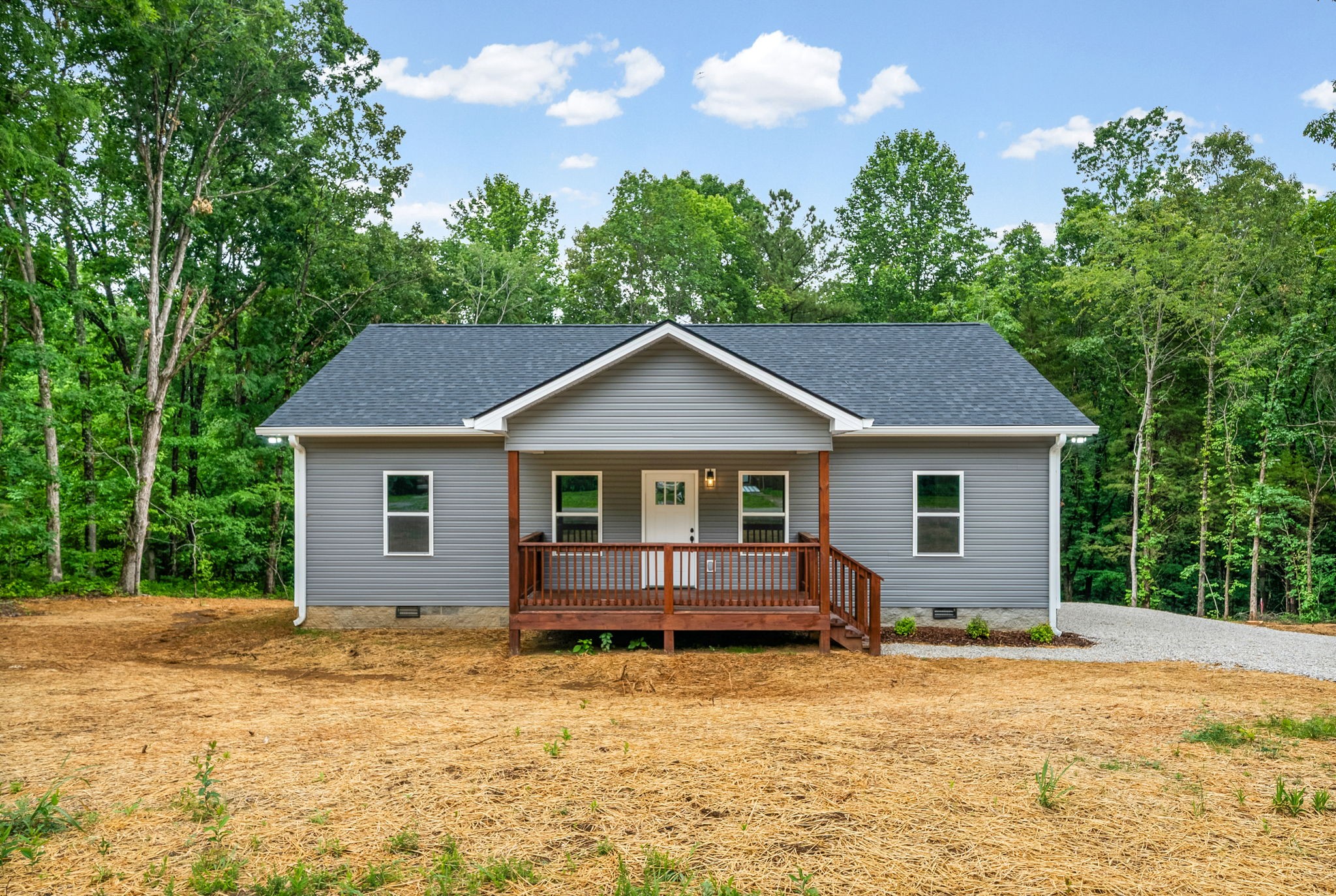 690 Brazzle Road Waverly, TN 37185 - Photo 3 of 35 a front view of house with yard and trees in the background
