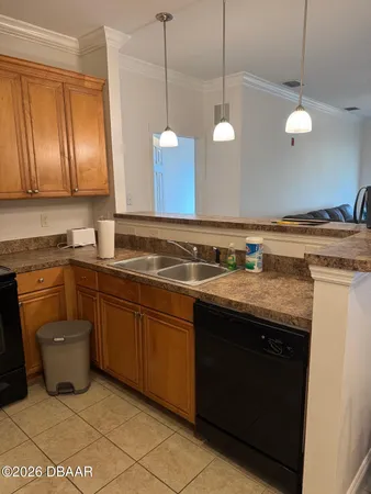 a kitchen with a sink a stove and cabinets