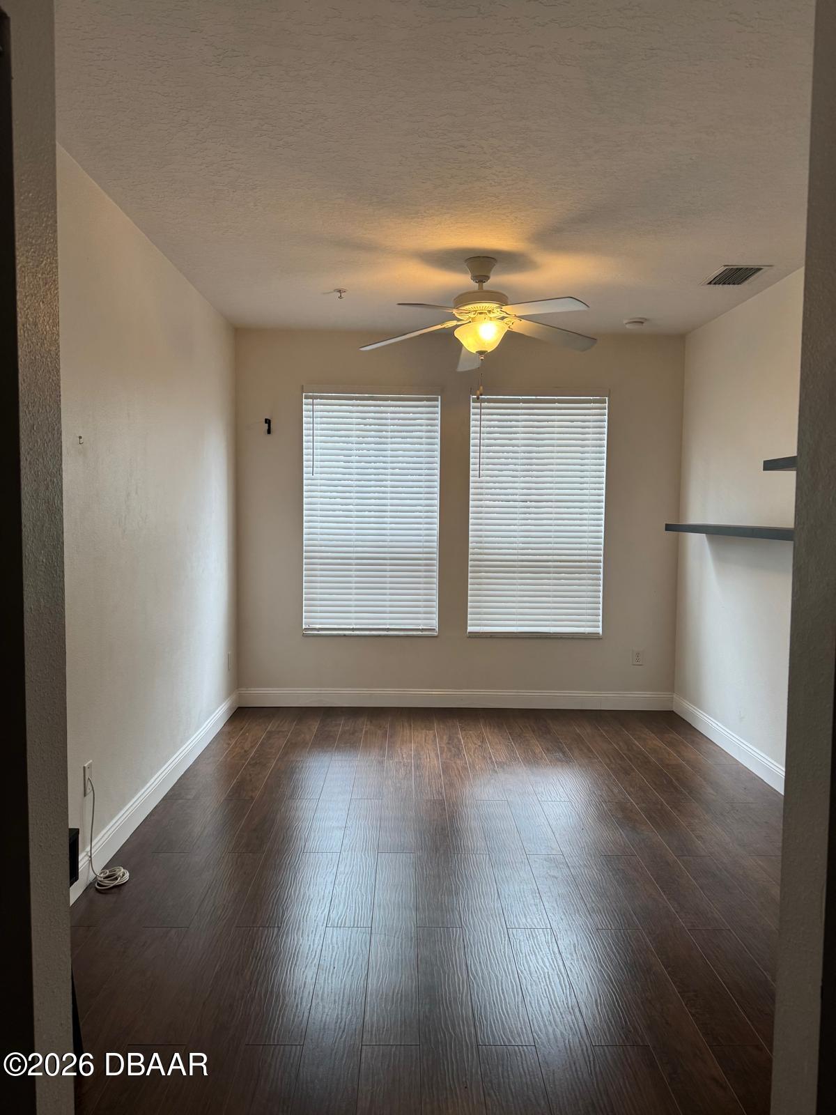 1185 Southwest 9th Road Gainesville, FL 32601 - Photo 15 of 25 an empty room with wooden floor and windows