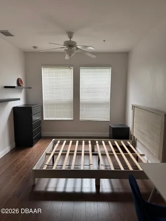 a view of bedroom with furniture and window