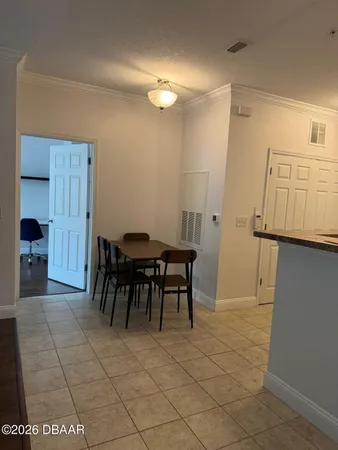 a view of a dining area with furniture and a chandelier