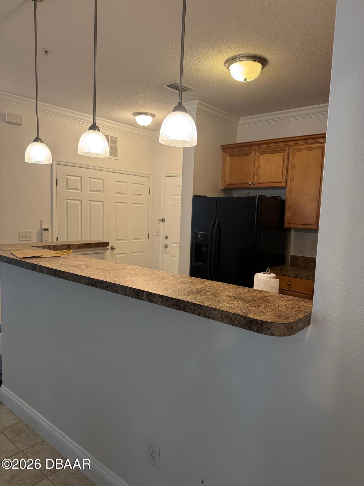 1185 Southwest 9th Road Gainesville, FL 32601 - Photo 24 of 25 a room with a chandelier and a wooden floor